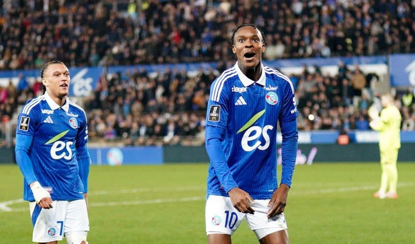 Emanuel Emegha reacts with a Strasbourg team-mate during a Ligue 1 match